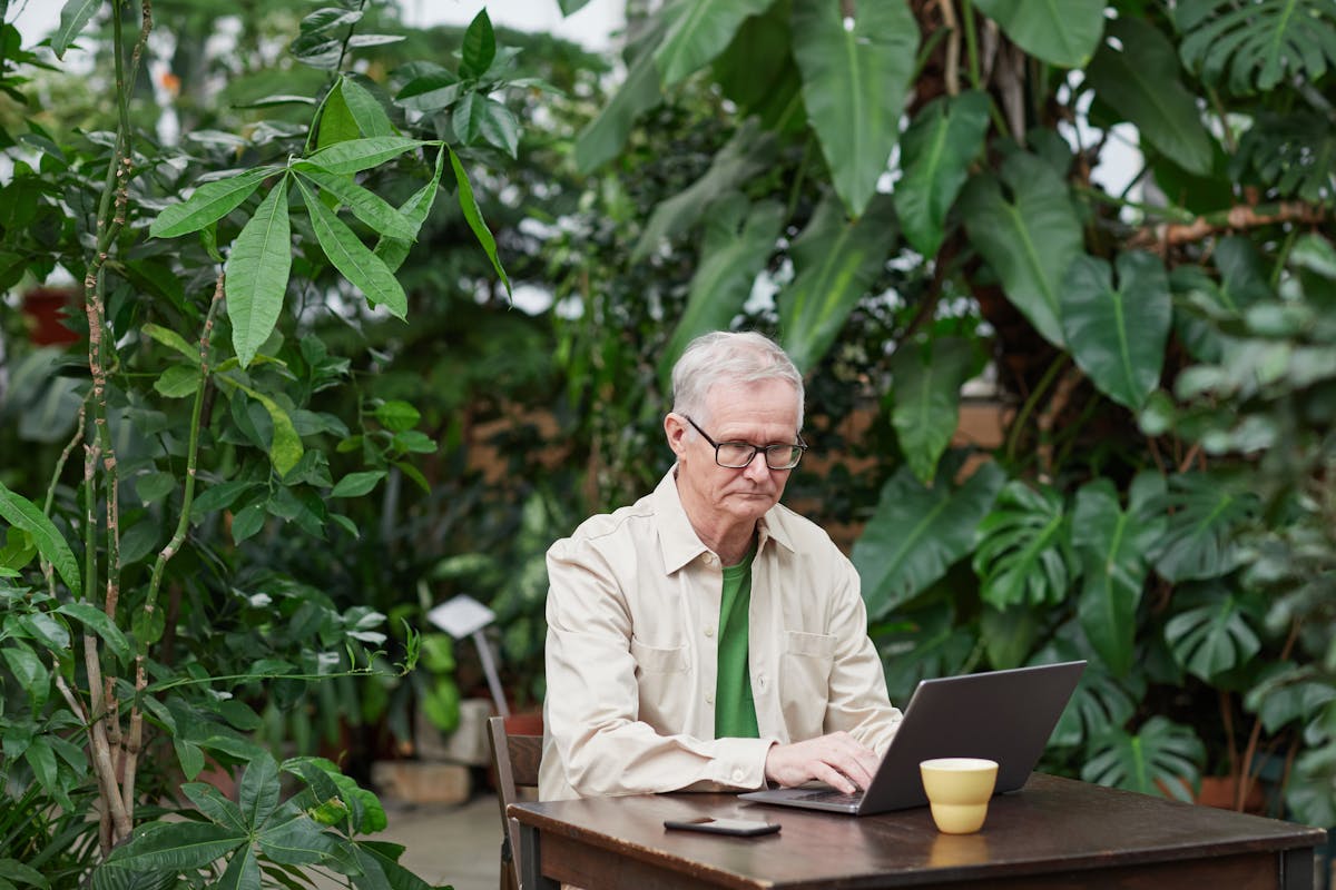 Independent contractor working on laptop, reviewing business finances