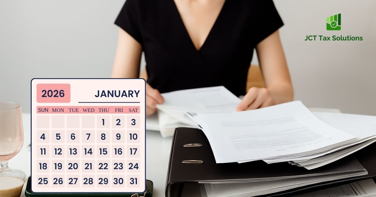 Person at desk reviewing documents with a January 2026 calendar