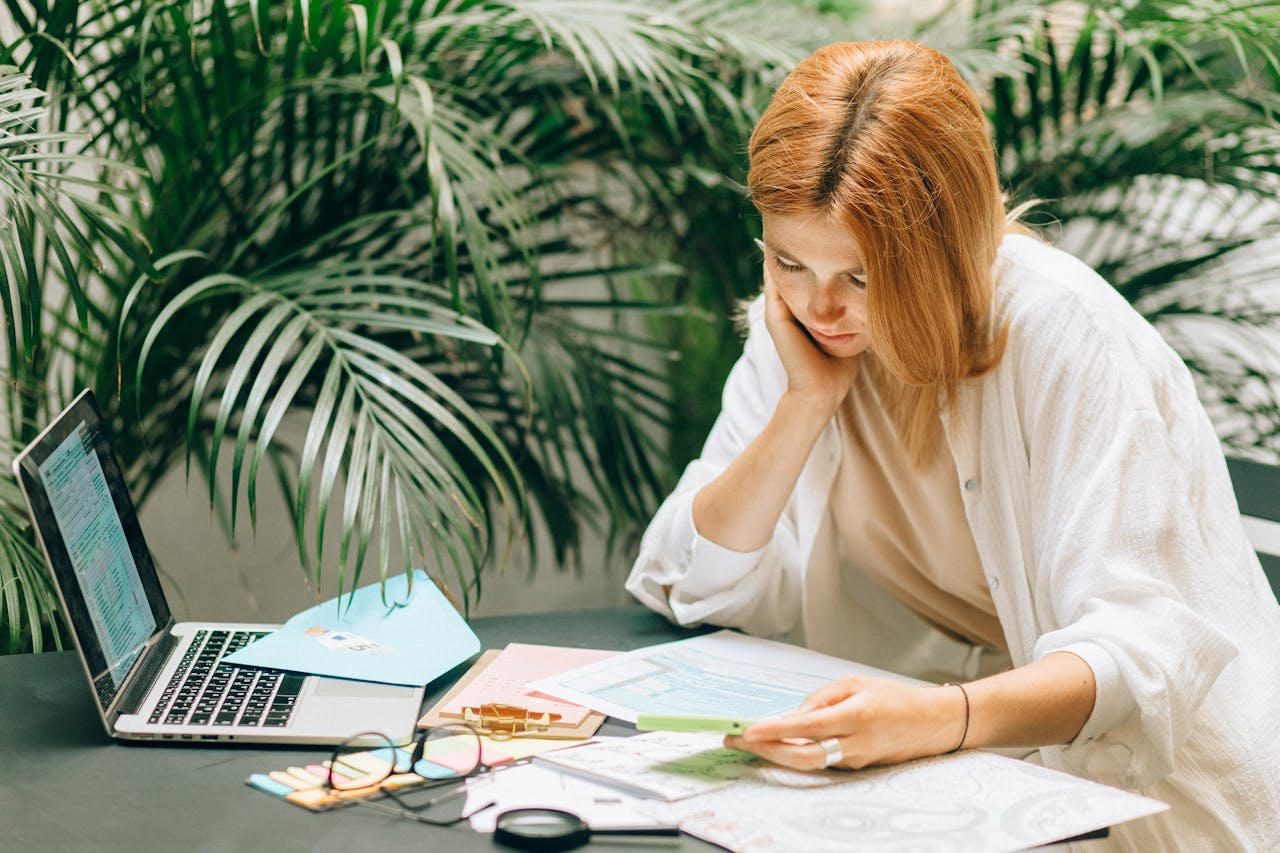 A woman reviewing tax documents