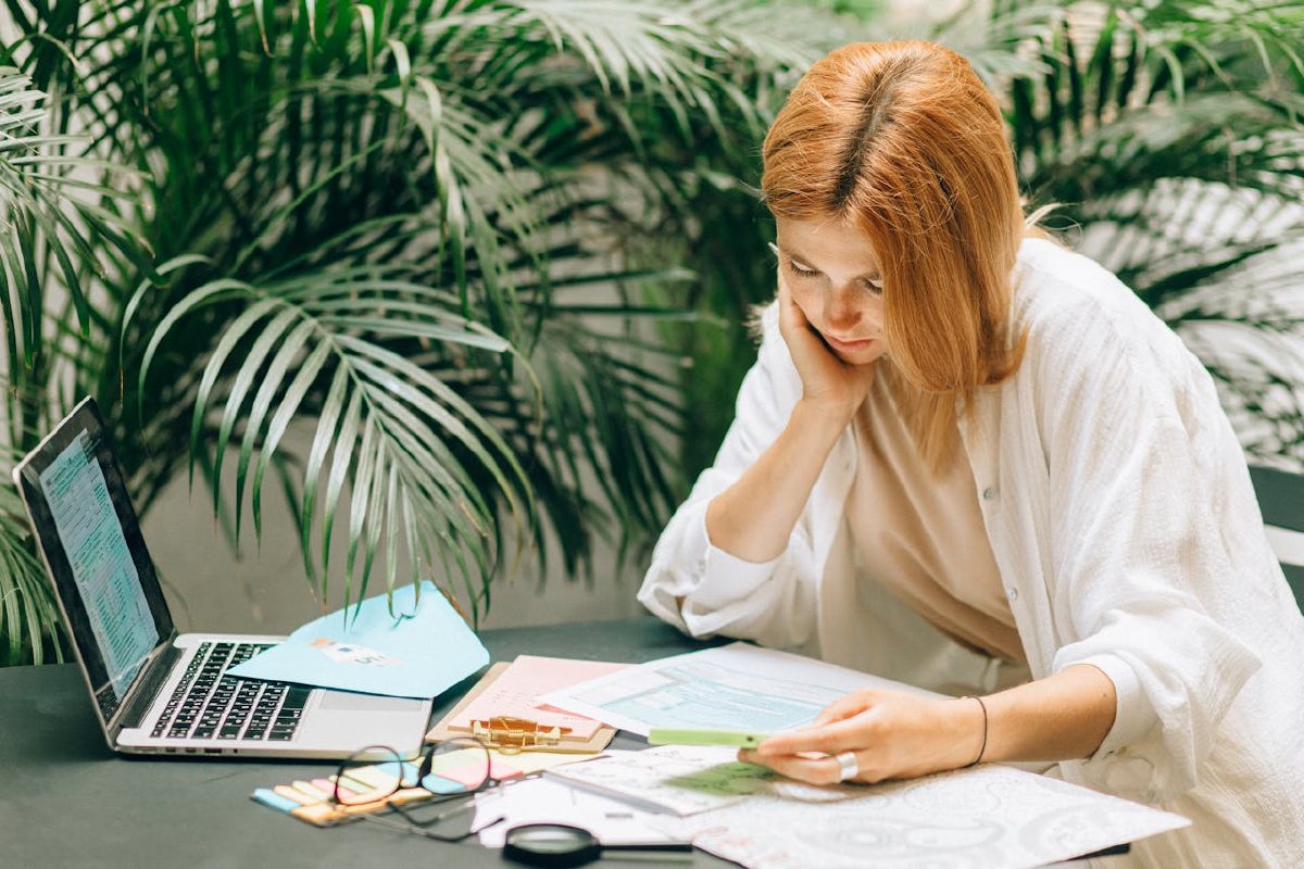 A woman reviewing tax documents