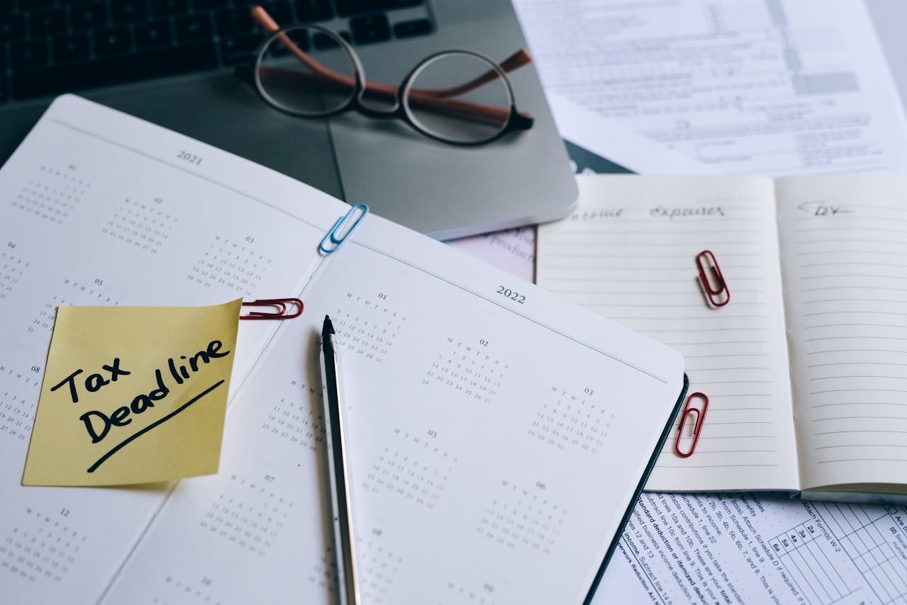 A planner with a sticky note